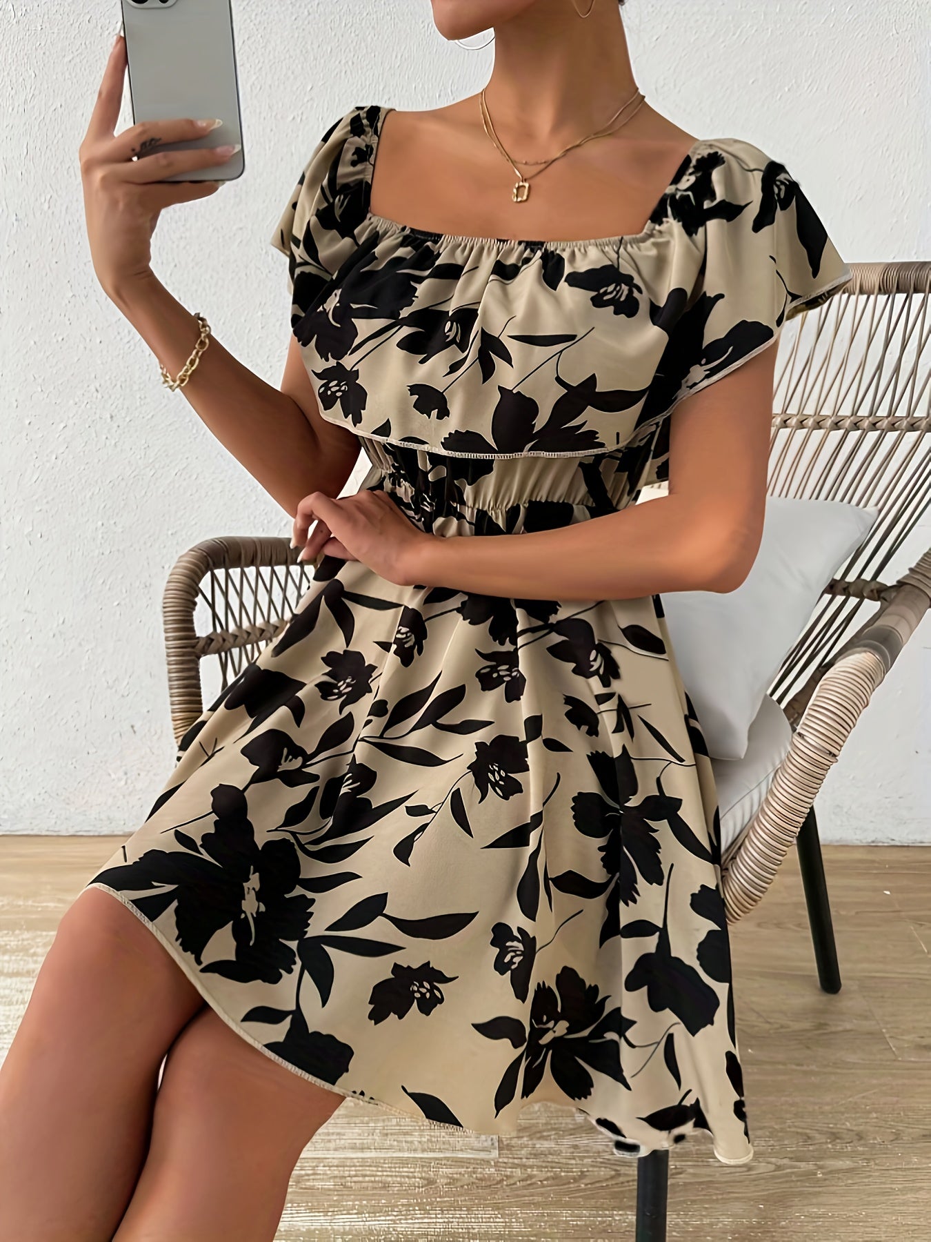 A Stylish Off-Shoulder Dress for Women, Featuring a Floral Pattern And a Ruffled Hem.