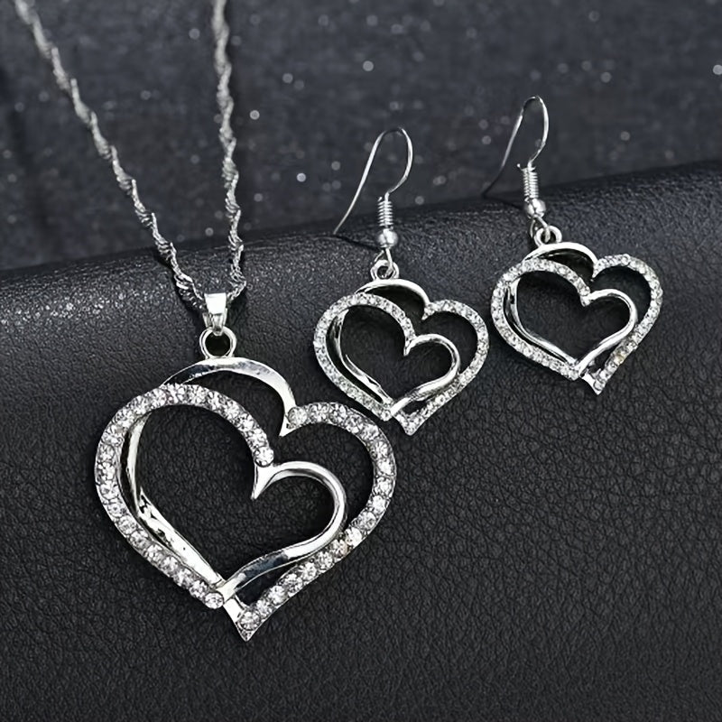 A Creative And Unique Jewelry Set Consisting Of 1 Pair Of Earrings And 1 Necklace, Featuring A Sparkling Heart-shaped Design With Shiny Rhinestones, Perfect For Accessorizing Daily Outfits Or Party Wear.