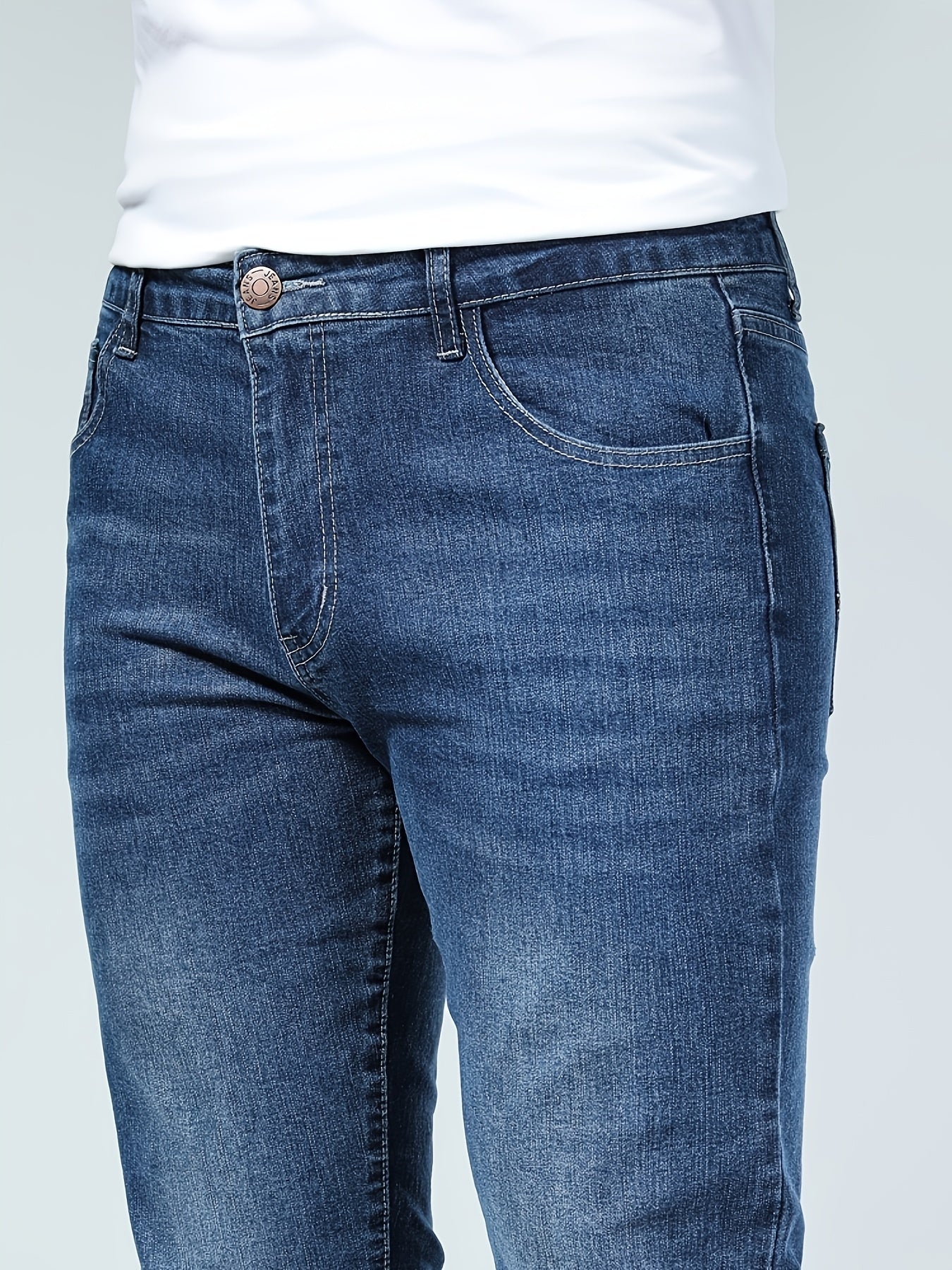 Premium Casual Men'S Jeans with a Slim Fit, Suitable for Light Business Wear, Featuring Stretchy Fabric And a Stylish Blue Wash.