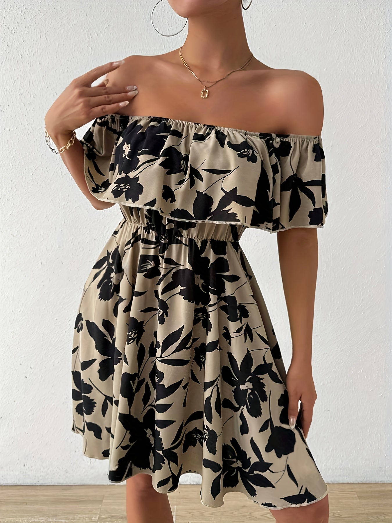 A Stylish Off-Shoulder Dress for Women, Featuring a Floral Pattern And a Ruffled Hem.