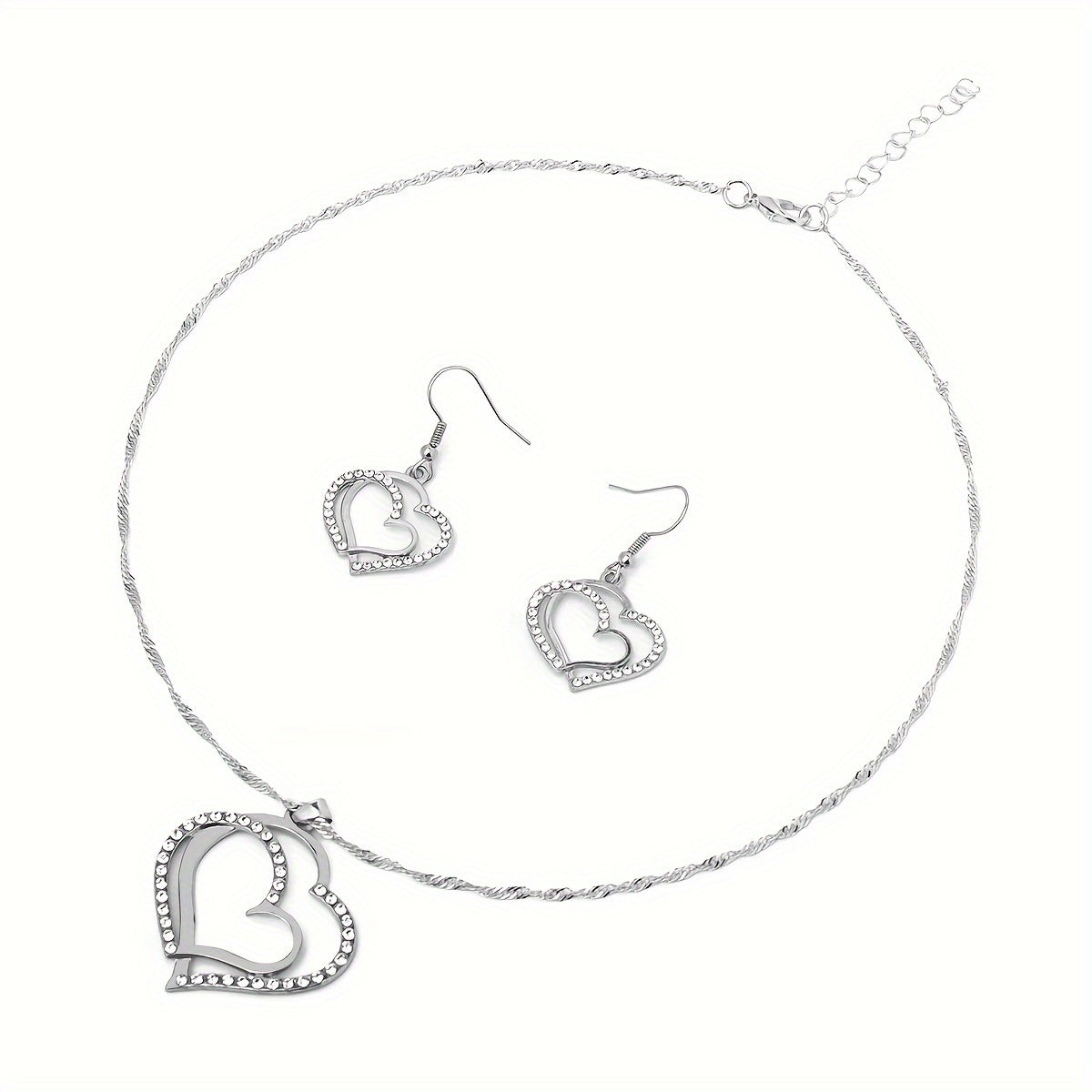 A Creative And Unique Jewelry Set Consisting Of 1 Pair Of Earrings And 1 Necklace, Featuring A Sparkling Heart-shaped Design With Shiny Rhinestones, Perfect For Accessorizing Daily Outfits Or Party Wear.