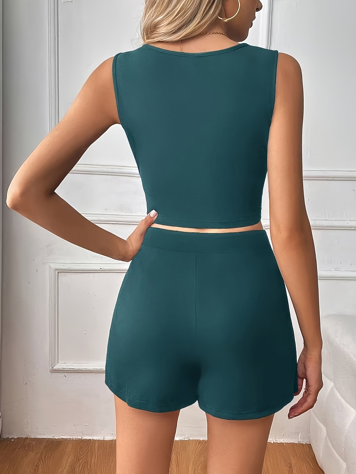 Sexy Sleeveless Top with Waist Cutout & Asymmetrical Mini Skirt