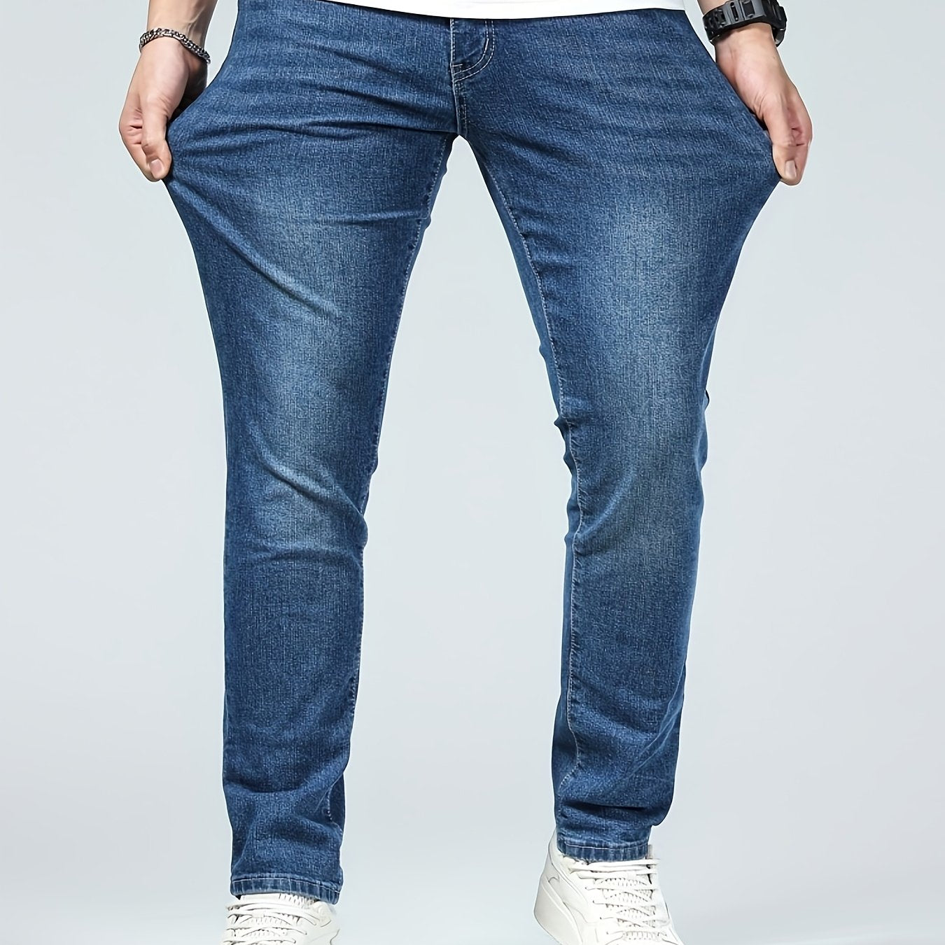 Premium Casual Men'S Jeans with a Slim Fit, Suitable for Light Business Wear, Featuring Stretchy Fabric And a Stylish Blue Wash.