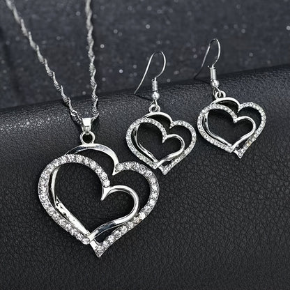 A Creative And Unique Jewelry Set Consisting Of 1 Pair Of Earrings And 1 Necklace, Featuring A Sparkling Heart-shaped Design With Shiny Rhinestones, Perfect For Accessorizing Daily Outfits Or Party Wear.