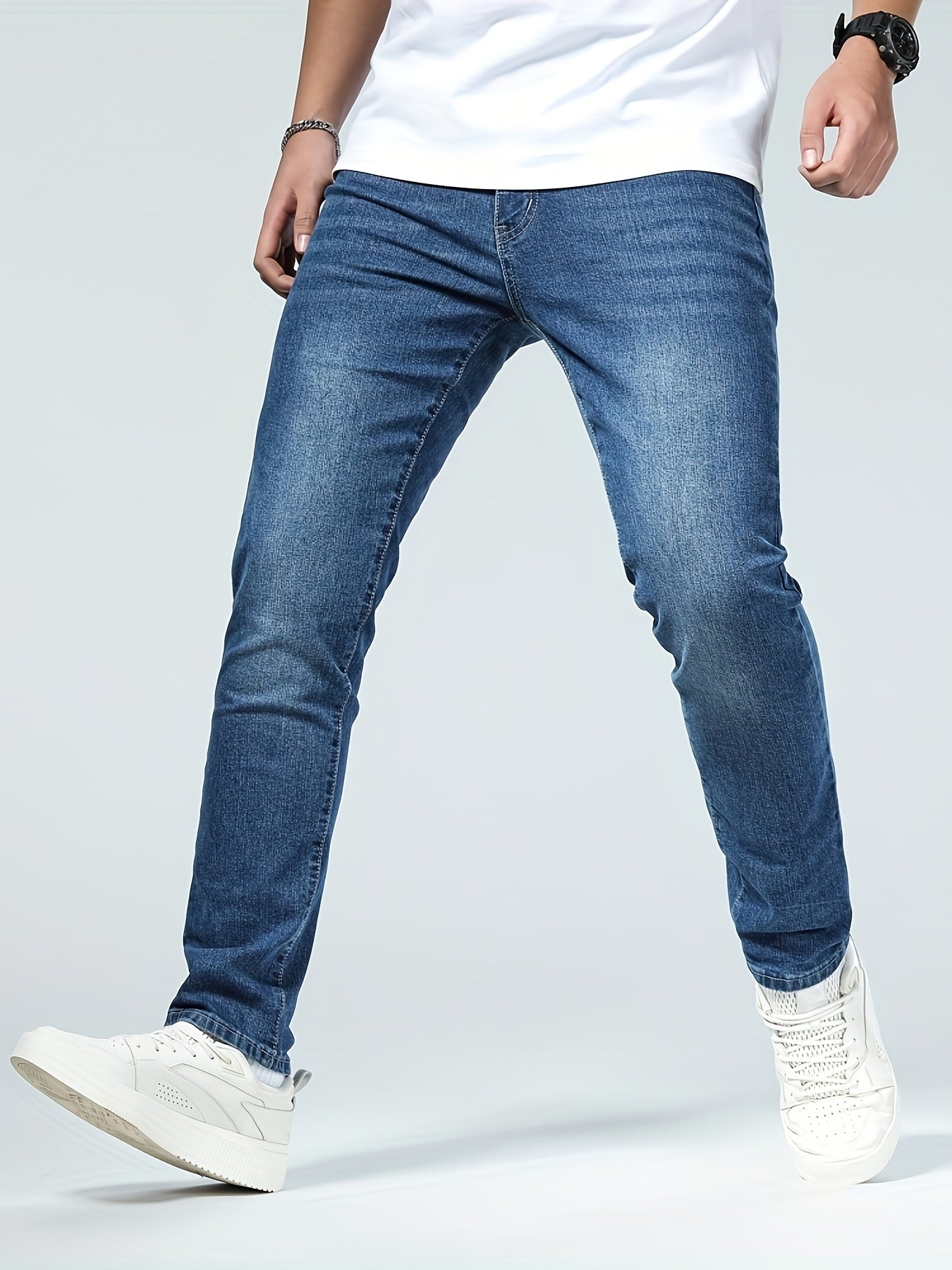 Premium Casual Men'S Jeans with a Slim Fit, Suitable for Light Business Wear, Featuring Stretchy Fabric And a Stylish Blue Wash.