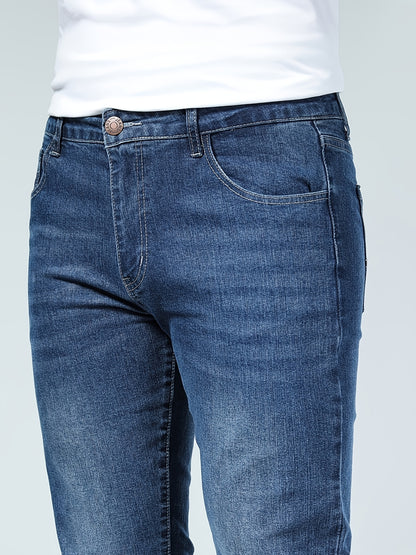 Premium Casual Men'S Jeans with a Slim Fit, Suitable for Light Business Wear, Featuring Stretchy Fabric And a Stylish Blue Wash.