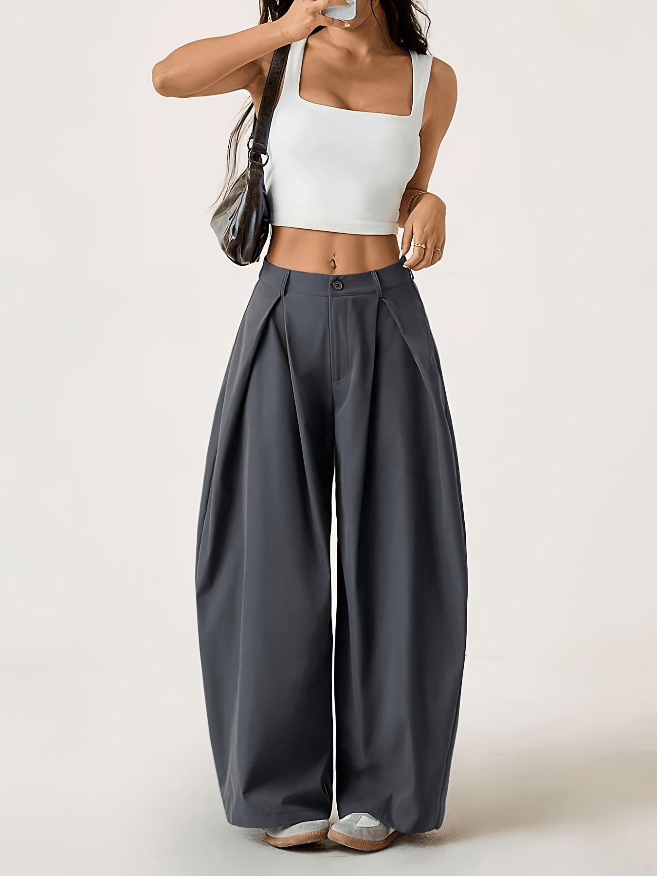Elegant Wide-Leg Trousers with Curved Hem and Smock Detail