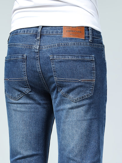 Premium Casual Men'S Jeans with a Slim Fit, Suitable for Light Business Wear, Featuring Stretchy Fabric And a Stylish Blue Wash.