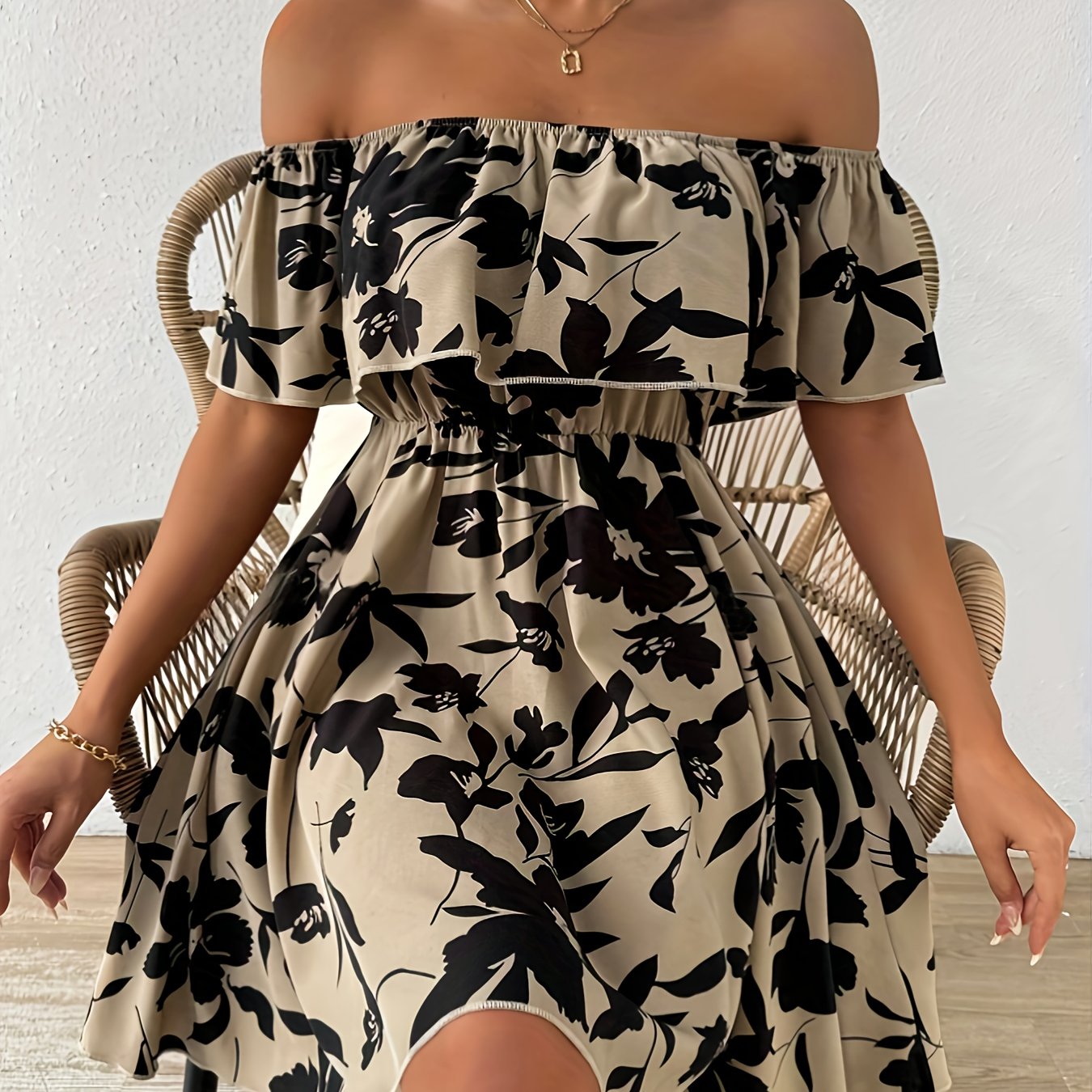 A Stylish Off-Shoulder Dress for Women, Featuring a Floral Pattern And a Ruffled Hem.